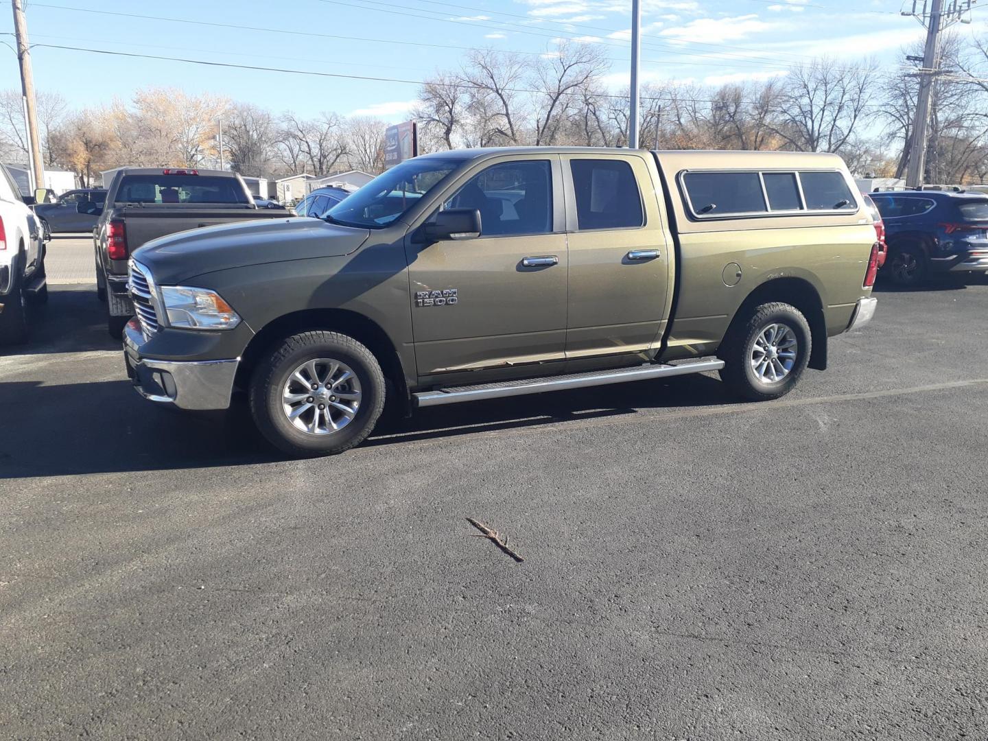 2013 RAM 1500 SLT Quad Cab 4WD (1C6RR7GG9DS) with an 3.6L V6 DOHC 24V FFV engine, 6-Speed Automatic transmission, located at 2015 Cambell Street, Rapid City, SD, 57701, (605) 342-8326, 44.066433, -103.191772 - CARFAX AVAILABLE - Photo#1