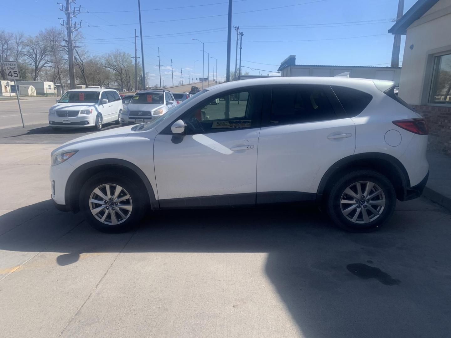 2016 Mazda CX-5 Touring AWD (JM3KE4CY9G0) with an 2.5L L4 DOHC 16V engine, 6-Speed Automatic transmission, located at 2015 Cambell Street, Rapid City, SD, 57701, (605) 342-8326, 44.066433, -103.191772 - Photo#2