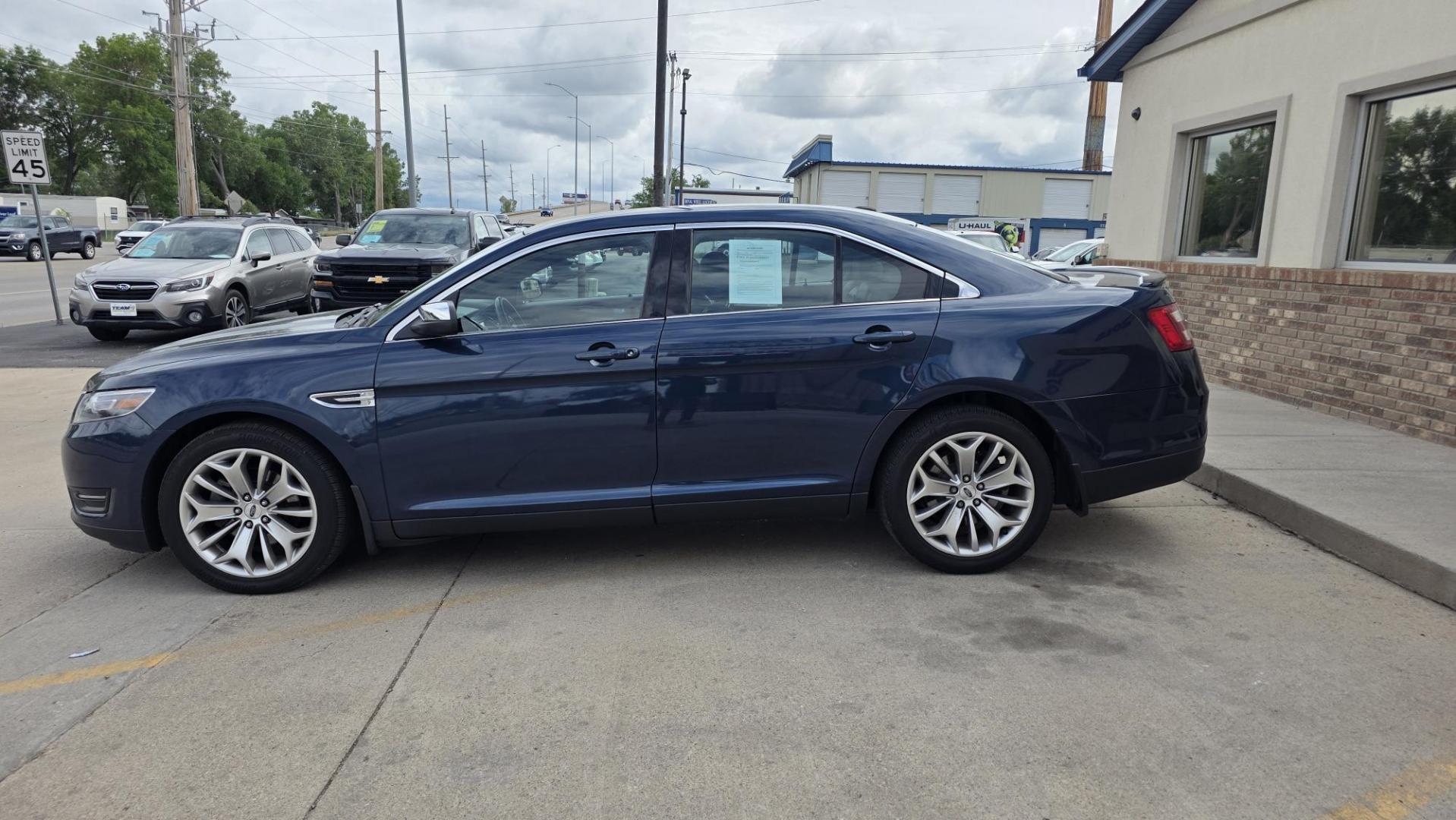 2016 Blue Ford Taurus Limited FWD (1FAHP2F80GG) with an 3.5L V6 DOHC 24V engine, 6A transmission, located at 2015 Cambell Street, Rapid City, SD, 57701, (605) 342-8326, 44.066433, -103.191772 - JUST ARRIVED- Photo#2