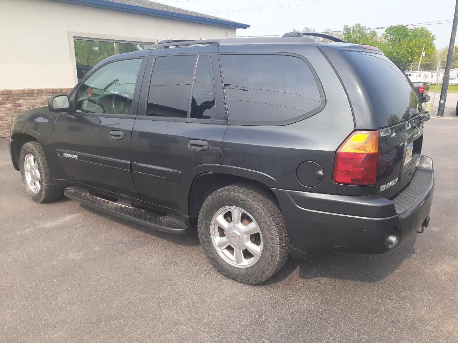 2004 GMC Envoy (1GKDT13S642) with an L6, 4.2L; DOHC engine, located at 2015 Cambell Street, Rapid City, SD, 57701, (605) 342-8326, 44.066433, -103.191772 - Photo #3